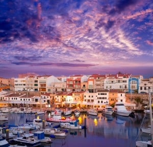 Ciutadella Menorca marina Port sunset with boats and streetlights in Balearic islands